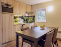 a kitchen with a dining table